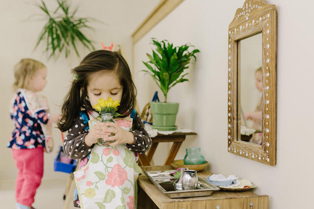 Child arranging flowers